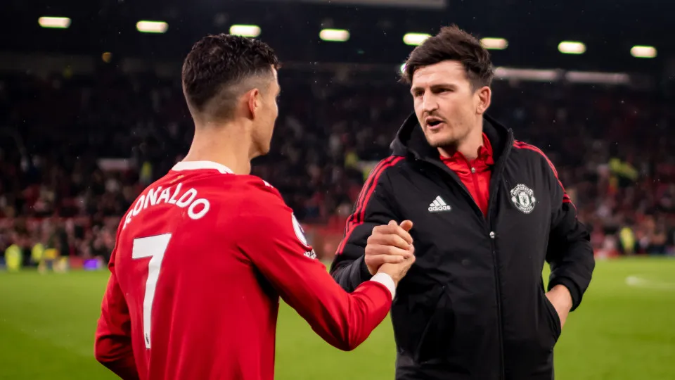MANCHESTER, ENGLAND - MAY 02:   Cristiano Ronaldo of Manchester United reacts to Harry Maguire at the end of the Premier League match between Manchester United and Brentford at Old Trafford on May 2, 2022 in Manchester, United Kingdom. (Photo by Ash Donel
