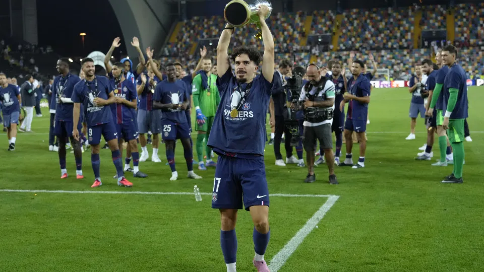 Vitinha central midfield of PSG and Portugal lifts the trophy after winning with his team the UEFA Super Cup 2025 match between Paris Saint-Germain and Tottenham Hotspur at Friuli Stadium on August 13, 2025 in Udine, Italy.  (Photo by Jose Breton/Pics Act