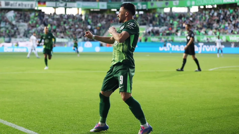 WOLFSBURG, GERMANY - MAY 09: Mohammed Amoura of VfL Wolfsburg celebrates after Leo Skiri Ostigard of TSG 1899 Hoffenheim (not pictured) conceded an own goal, resulting in the first goal for VfL Wolfsburg, during the Bundesliga match between VfL Wolfsburg 