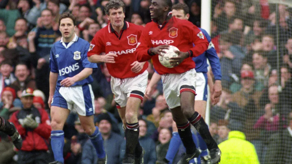 Manchester United's Andy Cole grabs the ball after scoring a hat trick during the 9-0 rout over Ipswich Town. Also pictured (l-r) Manchester United's Paul Ince and Mark Hughes and Ipswich Town's John Wark (far right) Dejected Ipswich Town players (John Wa