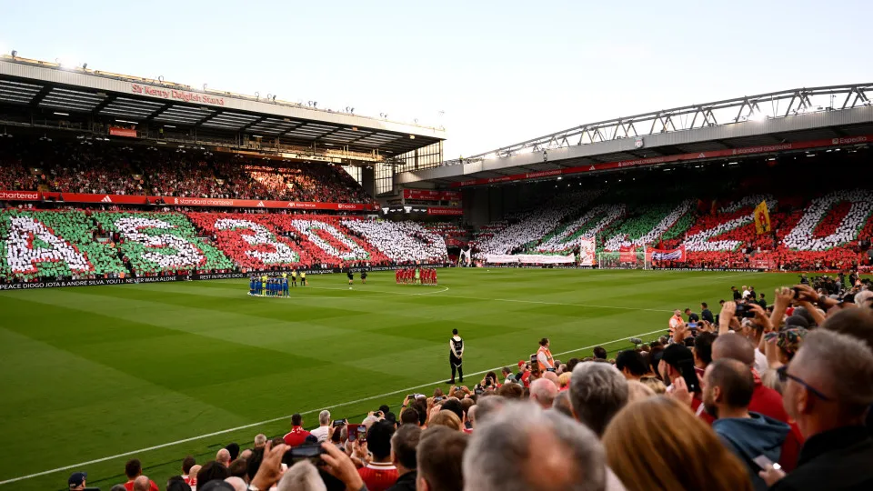 LIVERPOOL, ENGLAND - AUGUST 15: (THE SUN OUT, THE SUN ON SUNDAY OUT) Players, match officials and fans take part in a minute's silence as a fan mosaic depicting "AS30" and "DJ20" is displayed in memory of Diogo Jota and his brother Andre Silva prior to th