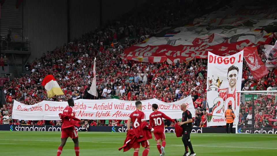 LIVERPOOL, ENGLAND - AUGUST 15: (THE SUN OUT, THE SUN ON SUNDAY OUT) Liverpool fans display banners and flags in memory of Diogo Jota and his brother Andre Silva prior to the Premier League match between Liverpool and Bournemouth at Anfield on August 15, 