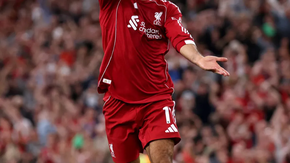 LIVERPOOL, ENGLAND - AUGUST 15: (THE SUN OUT, THE SUN ON SUNDAY OUT) Mohamed Salah of Liverpool performs the 'Shark' celebration in memory of former teammate Diogo Jota after scoring his team's fourth goal during the Premier League match between Liverpool