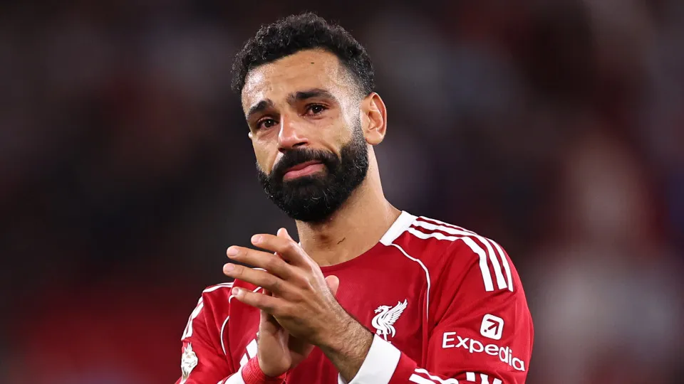LIVERPOOL, ENGLAND - AUGUST 15: An emotional Mohamed Salah of Liverpool claps along as Liverpool fans in The Top stand sing Diogo Jota's song at full time during the Premier League match between Liverpool and Bournemouth at Anfield on August 15, 2025 in L