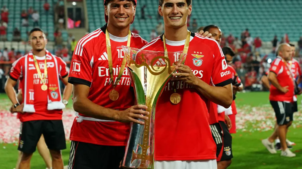FARO, PORTUGAL - JULY 31: Antonio Silva of SL Benfica (R) and Rafael Luis of SL Benfica (L) pose for a picture with trophy after winning the Portuguese Super Cup at the end of the Portuguese Super Cup match between Sporting CP and SL Benfica at Estadio Al