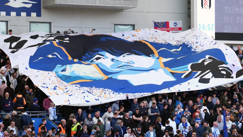 BRIGHTON, ENGLAND - MARCH 8: The Brighton & Hove Albion fans hold up a banner of Kaoru Mitoma
 during the Premier League match between Brighton & Hove Albion FC and Fulham FC at Amex Stadium on March 8, 2025 in Brighton, England. (Photo by Shaun Brooks -
