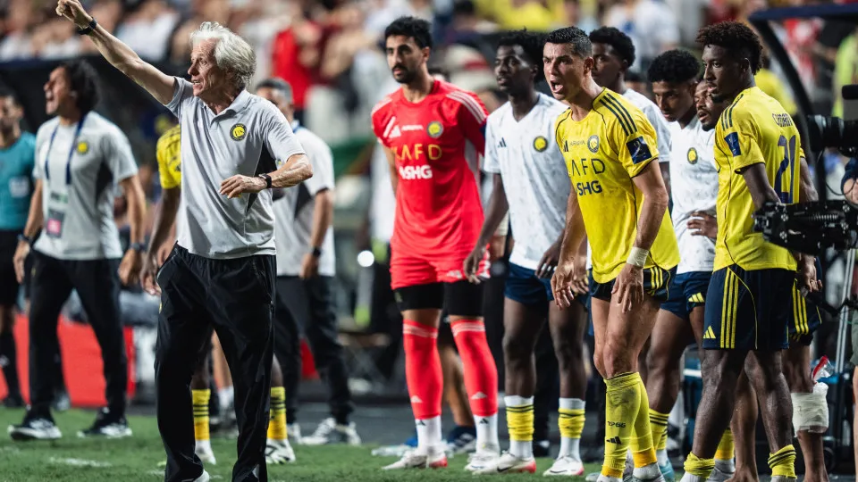 HONG KONG, CHINA - AUGUST 19: Team head coach Jorge Jesus (L) of Al-Nassr reacts with Cristiano Ronaldo (R) at the sideline during the Saudi Super Cup semi final between Al-Nassr and Al-Ittihad at Hong Kong Stadium on August 19, 2025 in Hong Kong, China. 
