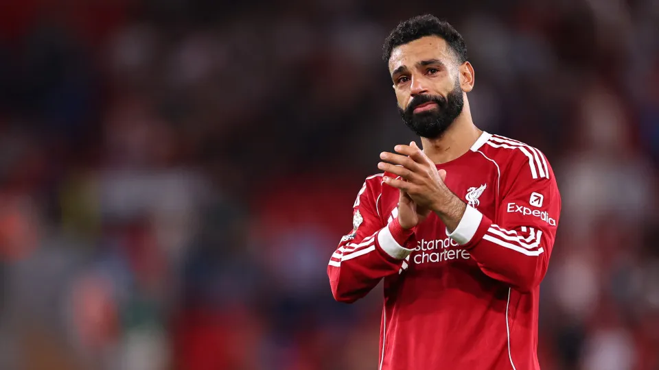 LIVERPOOL, ENGLAND - AUGUST 15: An emotional Mohamed Salah of Liverpool claps along as Liverpool fans in The Top stand sing Diogo Jota's song at full time during the Premier League match between Liverpool and Bournemouth at Anfield on August 15, 2025 in L
