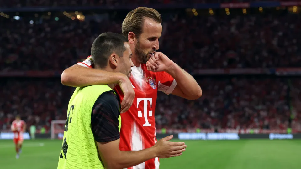 MUNICH, GERMANY - AUGUST 22: Harry Kane of Bayern Munich celebrates scoring his team's sixth goal and his hat trick goal with teammate Raphael Guerreiro during the Bundesliga match between FC Bayern München and RB Leipzig at Allianz Arena on August 22, 20