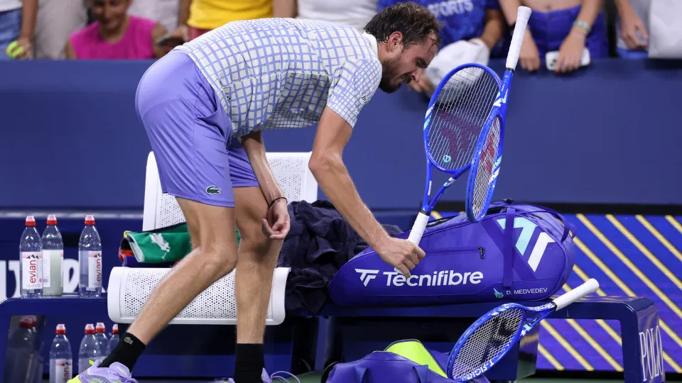 NEW YORK, NEW YORK - AUGUST 24: Daniil Medvedev breaks his racket after losing in five sets to Benjamin Bonzi of France during their Men's Singles First Round match on Day One of the 2025 US Open at USTA Billie Jean King National Tennis Center on August 2